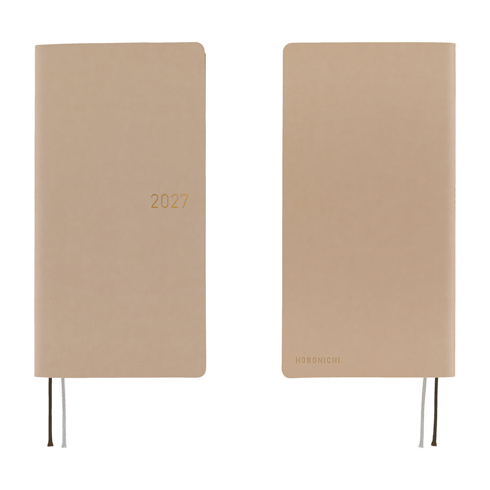 A front and back view of a planner with a sandy beige softcover that is flexible and slightly puffy. The year 2027 is embossed in gold on the front.