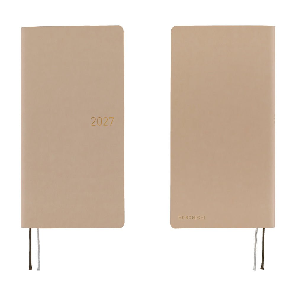 A front and back view of a planner with a sandy beige softcover that is flexible and slightly puffy. The year 2027 is embossed in gold on the front.
