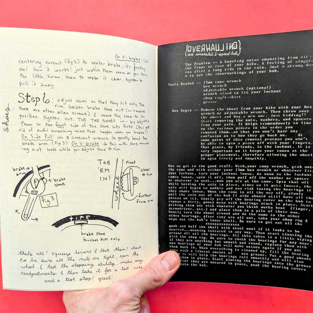Open book with handwritten notes and diagrams on a red background