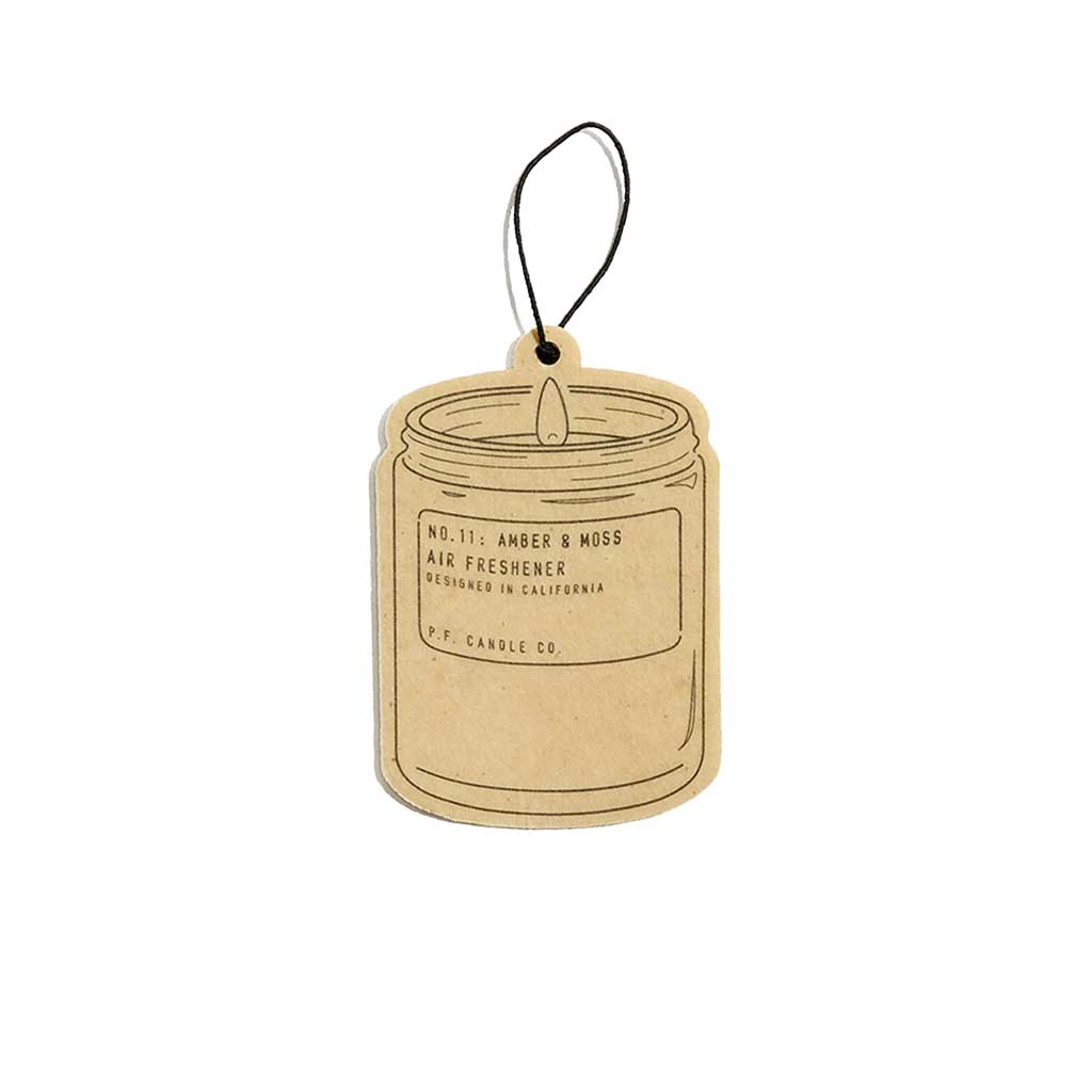 Amber and Moss air freshener tag on a white background