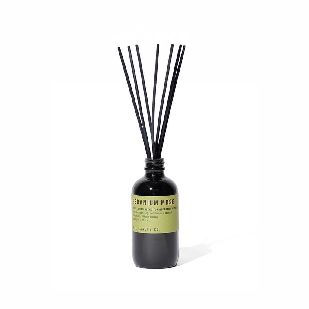 Geranium moss reed diffuser bottle with black reeds on white background