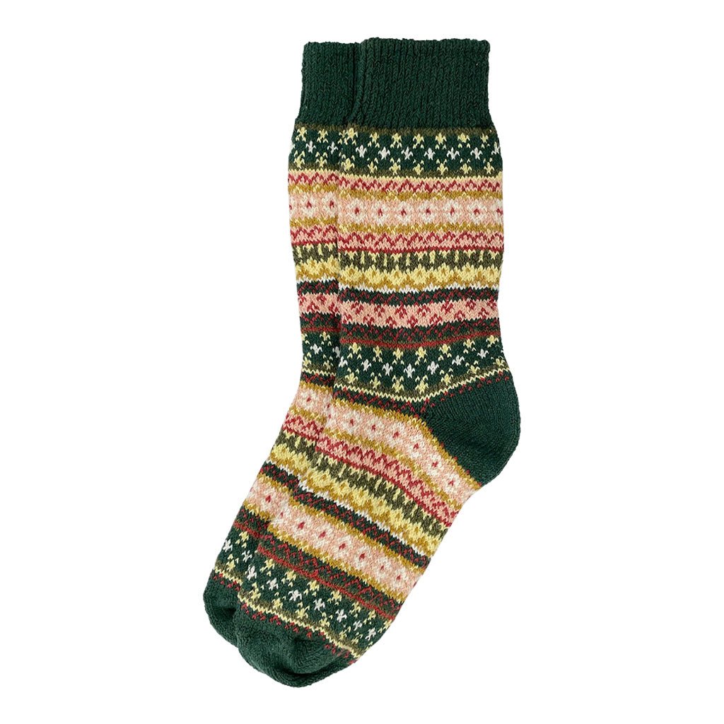 A colorful cotton sock in a fair isle pattern in shades of holly green, yellow, and red.