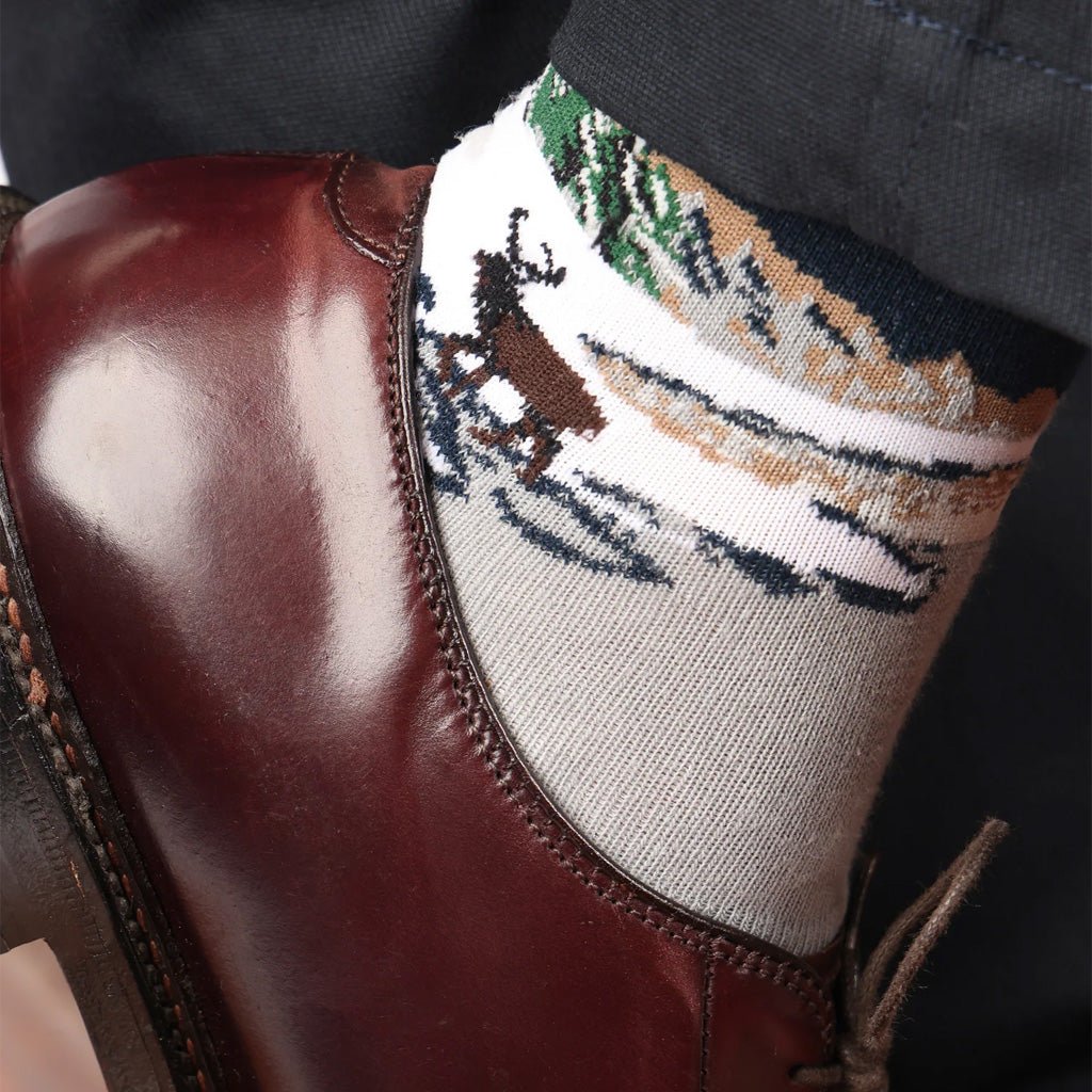Model wearing landscape crew sock and red loafer shoe.