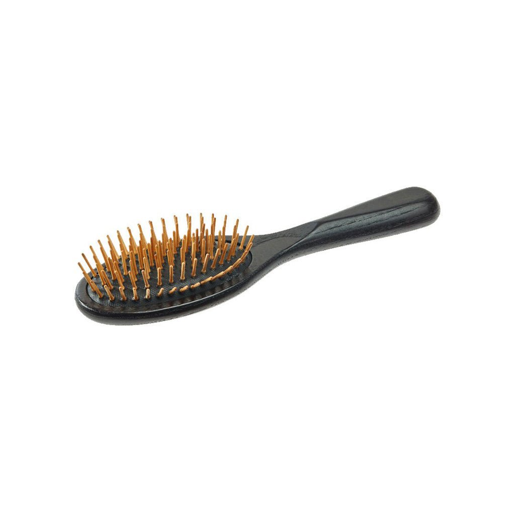 Wooden hairbrush with wooden pins on white background