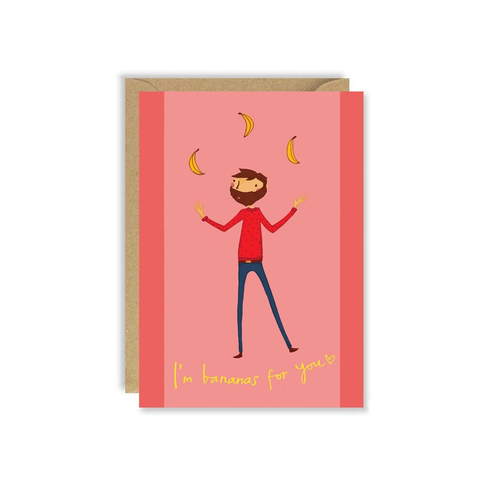 Greeting card featuring an illustration of a bearded man juggling bananas with text I’m bananas for you, paired with a kraft envelope.