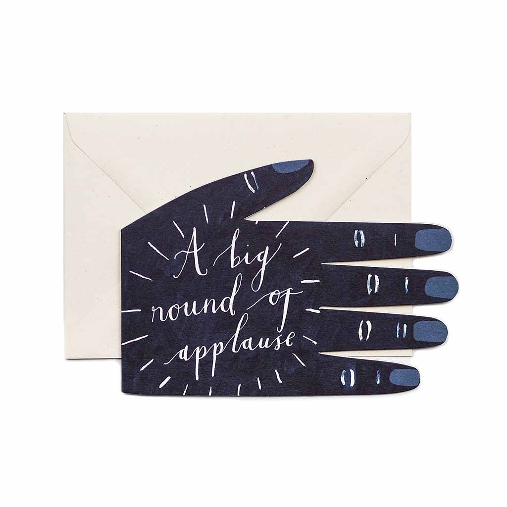 Blue hand-shaped greeting card reading “A Big Round of Applause,” shown with a cream envelope.