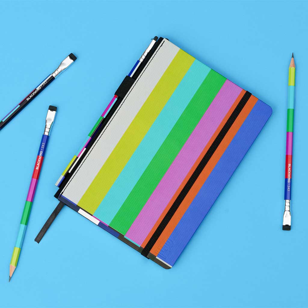 Notebook with colorful striped cover on a blue background with 343 pencils.