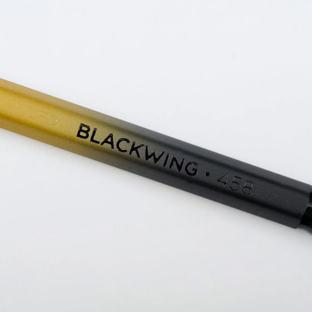 Close up of Blackwing 458 pencil with gradient design on light background