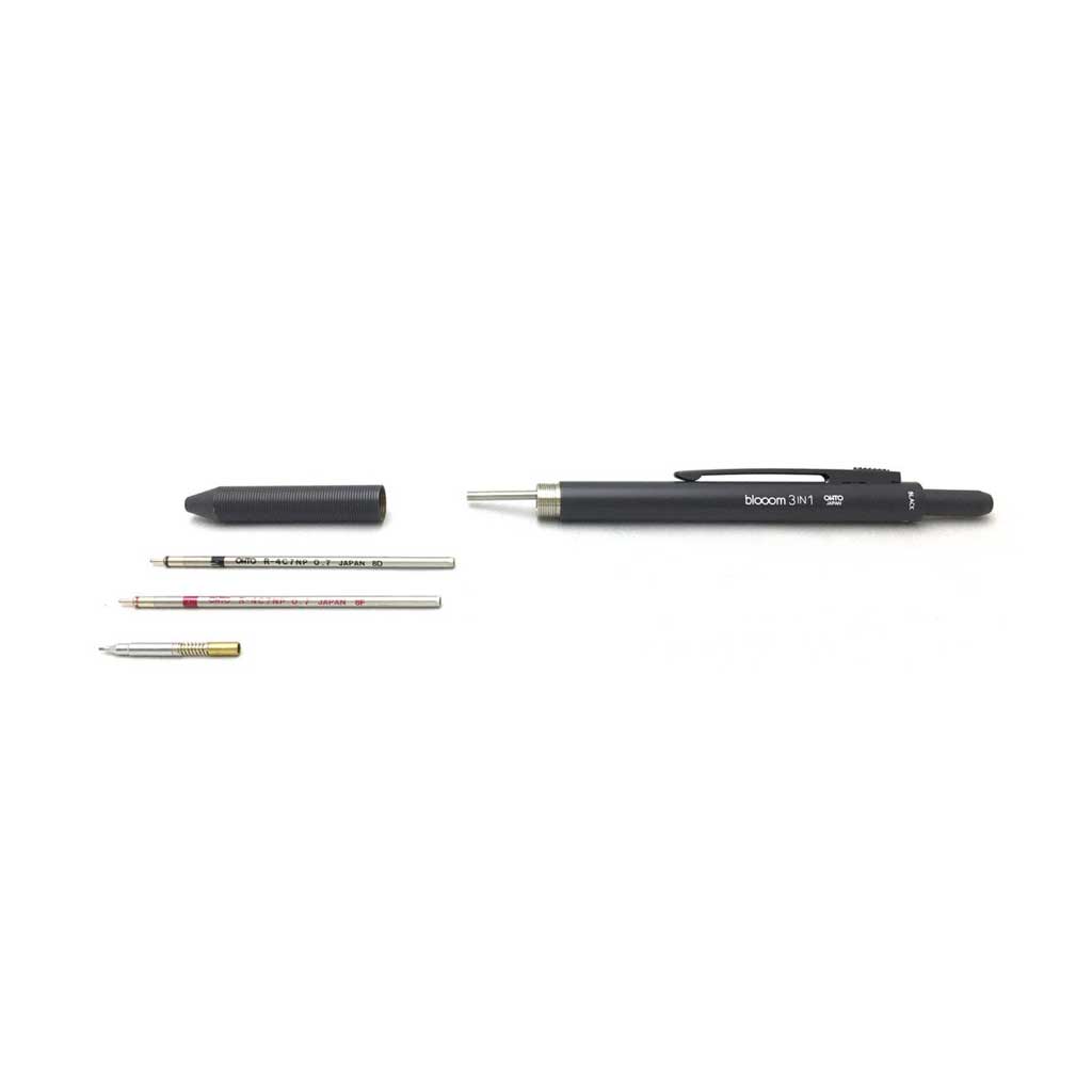 Pen taken apart with pieces on white background