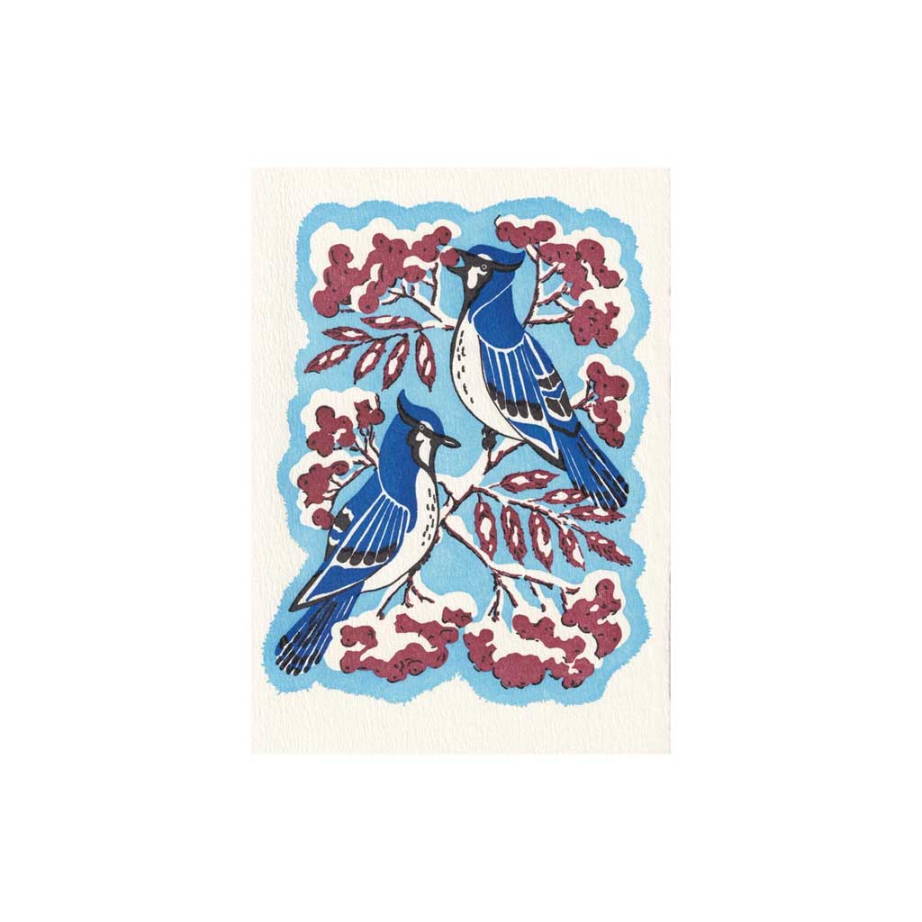 Greeting card with blue birds and red berries on a white background