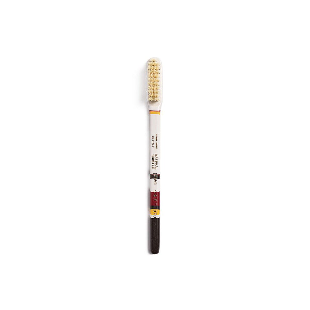 Brown and white colorful toothbrush on white background