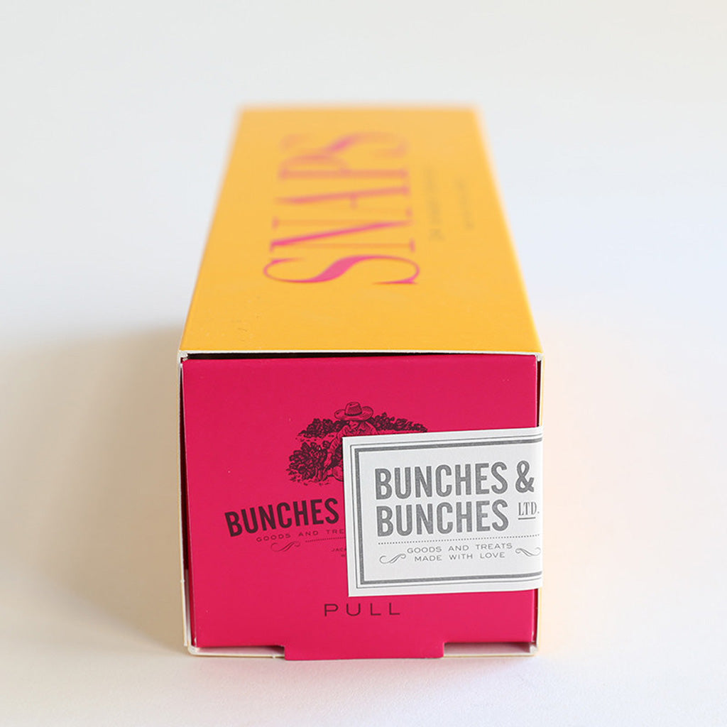 Side view of box of ginger snap cookies with Bunches & Bunches branding.