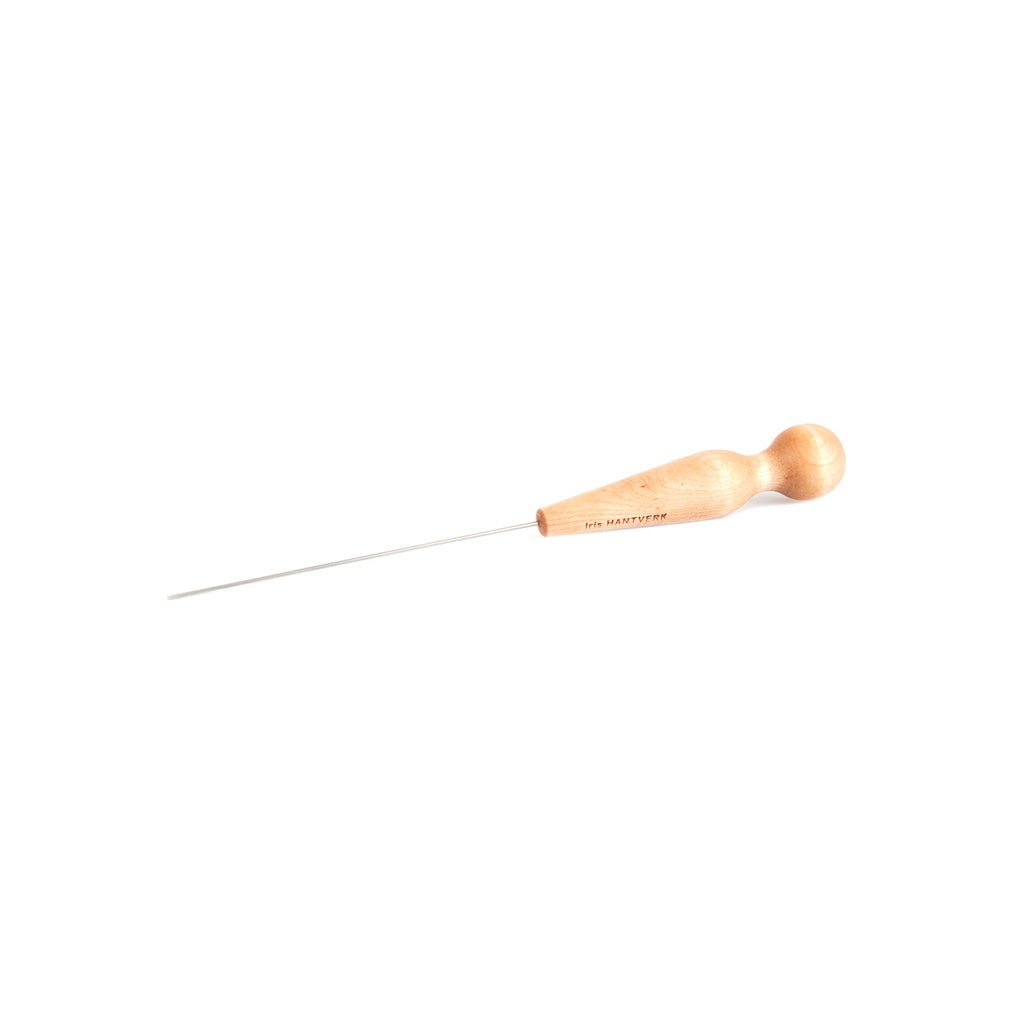 Wooden cake tester on white background