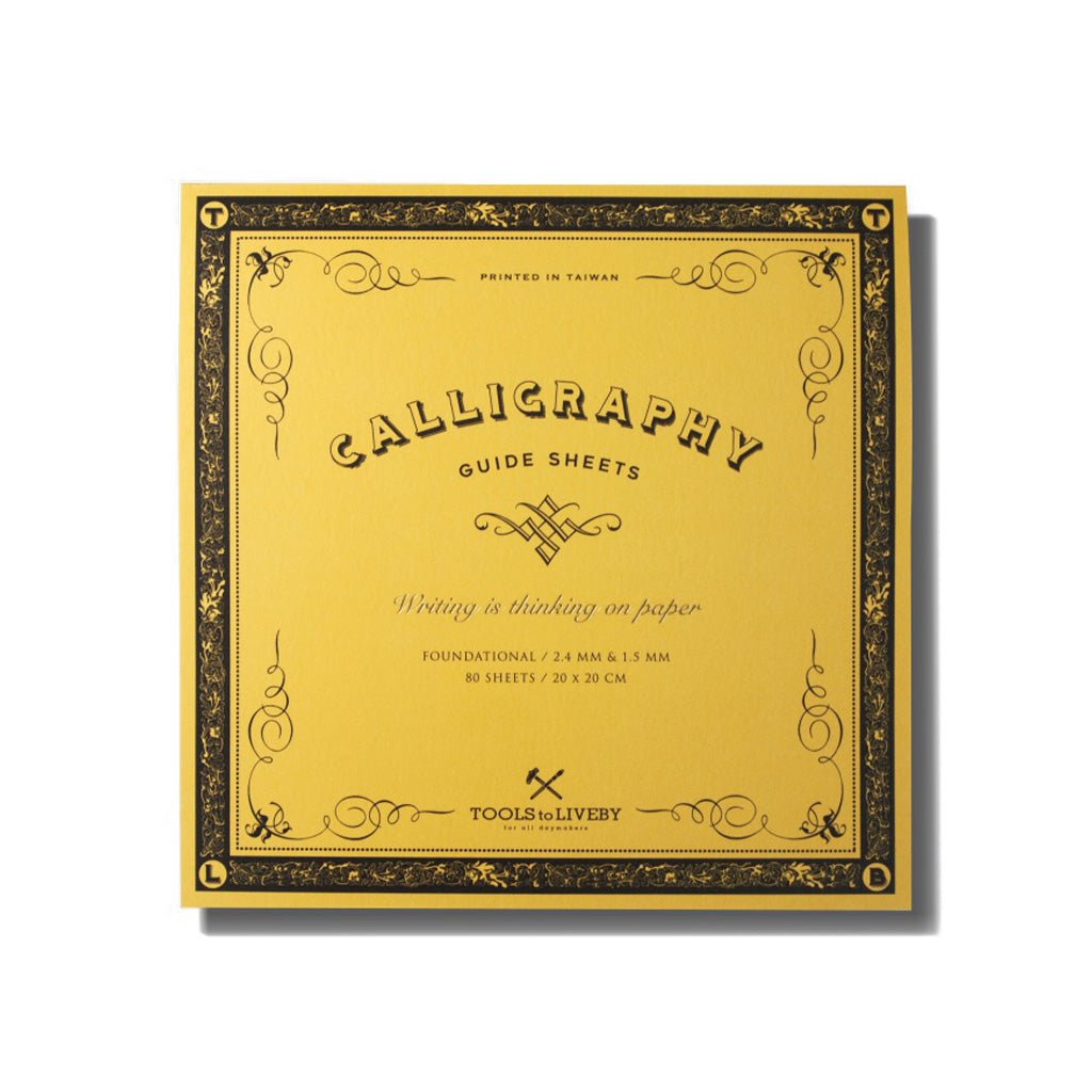 A yellow square calligraphy guide sheet book on white background