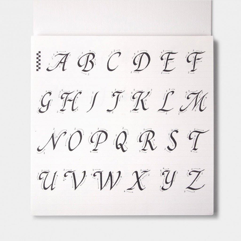 A calligraphy guide sheet with uppercase letters and guide lines on light background