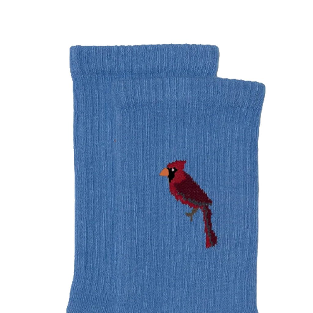 A pair of blue ribbed knit socks stacked on top of each other, featuring a small embroidered cardinal bird on the front sock.