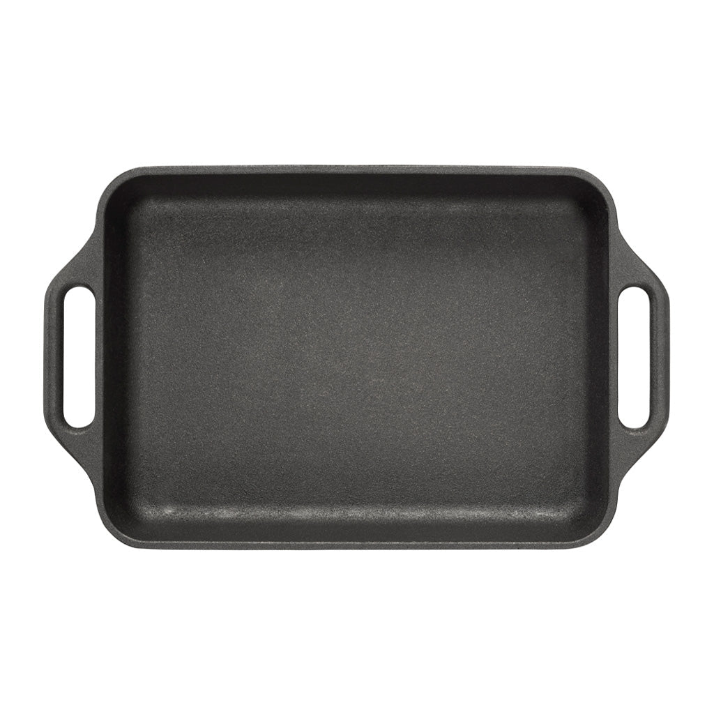 Black rectangular cast iron baking dish with handles on a white background