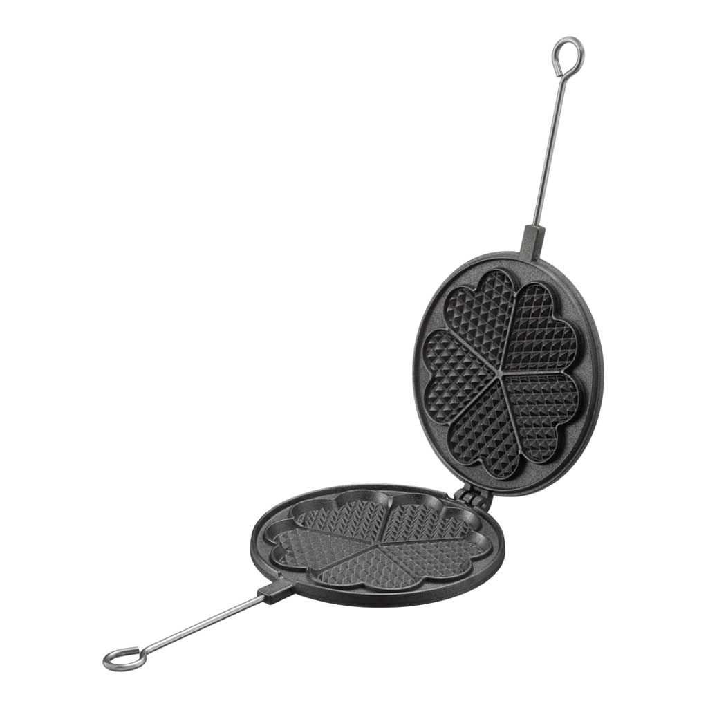 Black cast iron waffle iron open with aluminum handle on white background