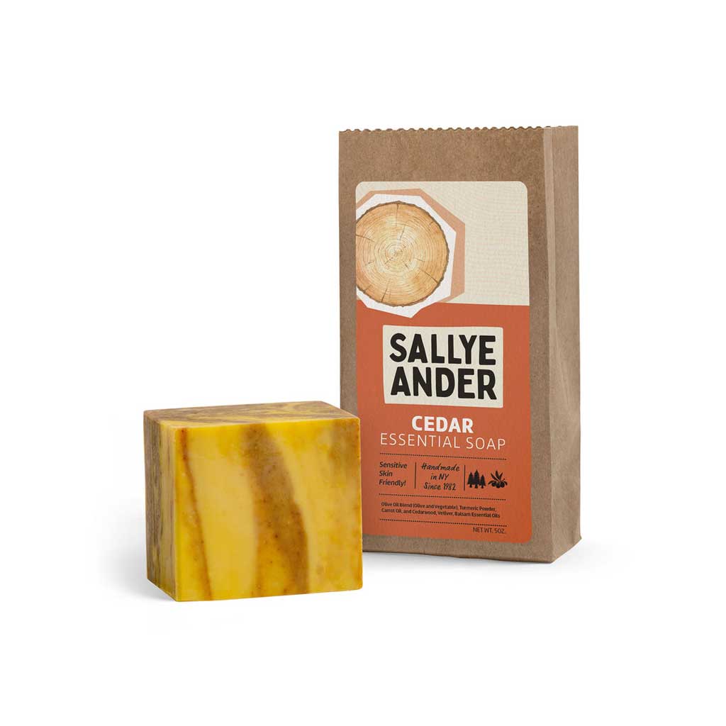 Yellow and brown swirled SallyeAnder cedar essential soap for oily, acne prone skin on white background