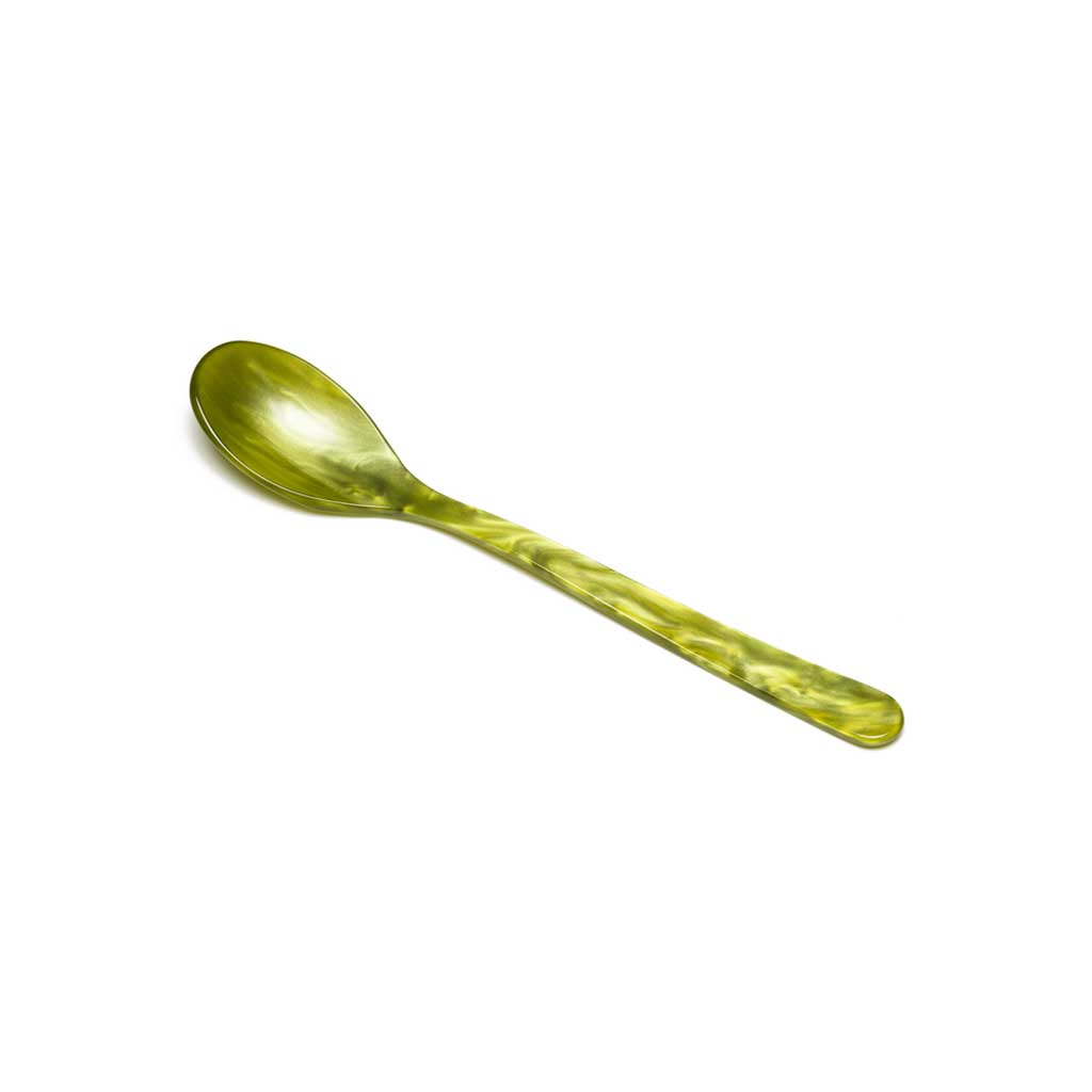 Olive green colored acrylic cereal spoon on white background