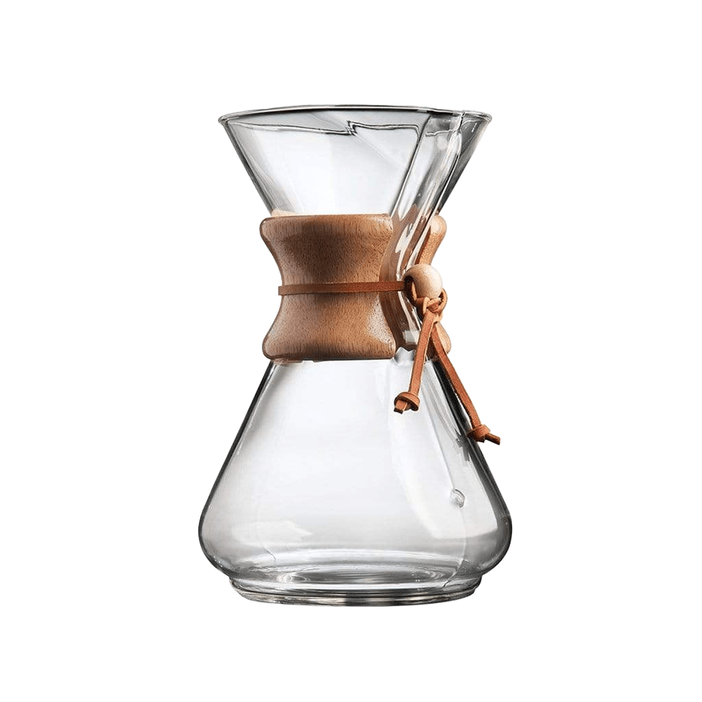 A Chemex coffee maker with a clear glass conical chamber, a natural wood collar, and a brown leather tie, shown on a solid white background.