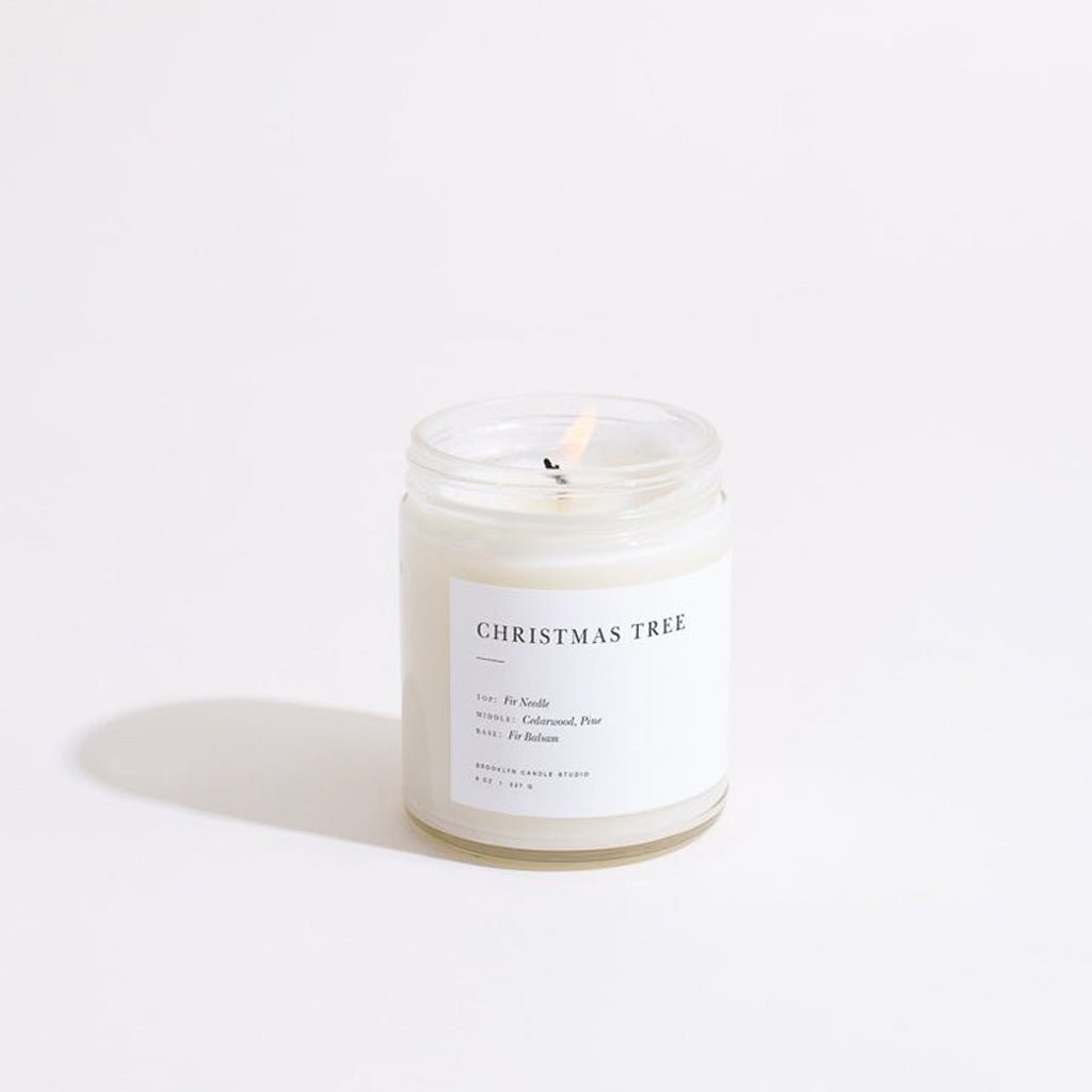 Candle labeled 'Christmas Tree' on a white background