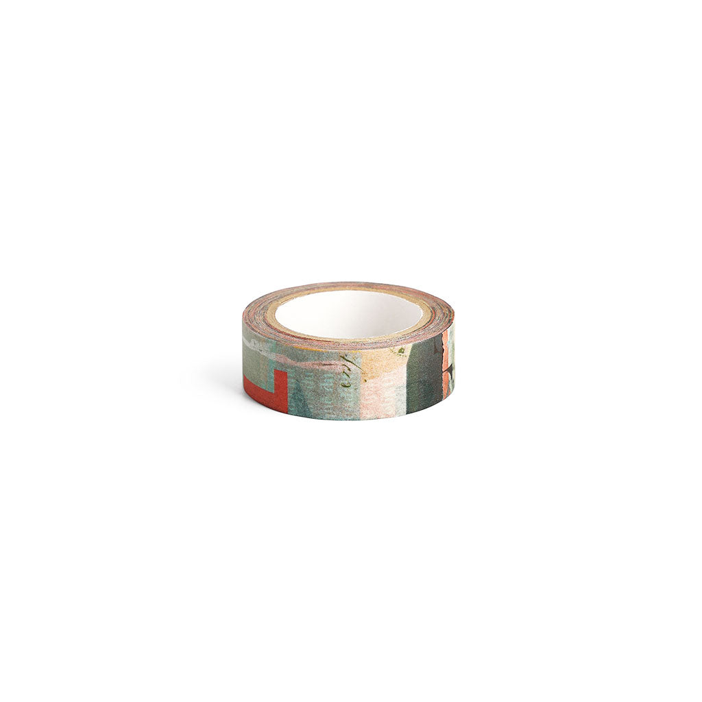 A roll of decorative washi tape featuring an abstract typographic print in muted teal, beige, and red.