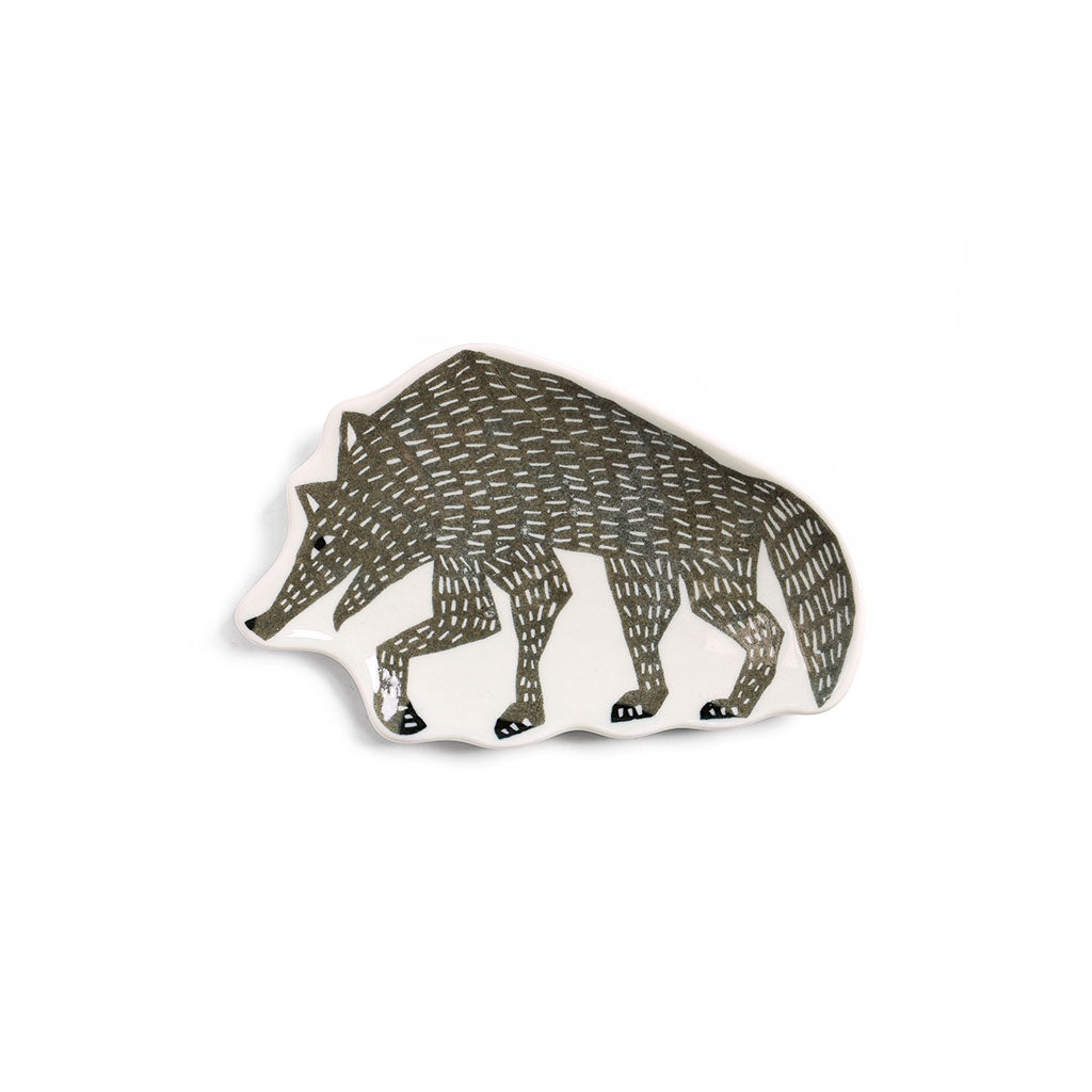Gray wolf-shaped ceramic dish with a textured pattern.