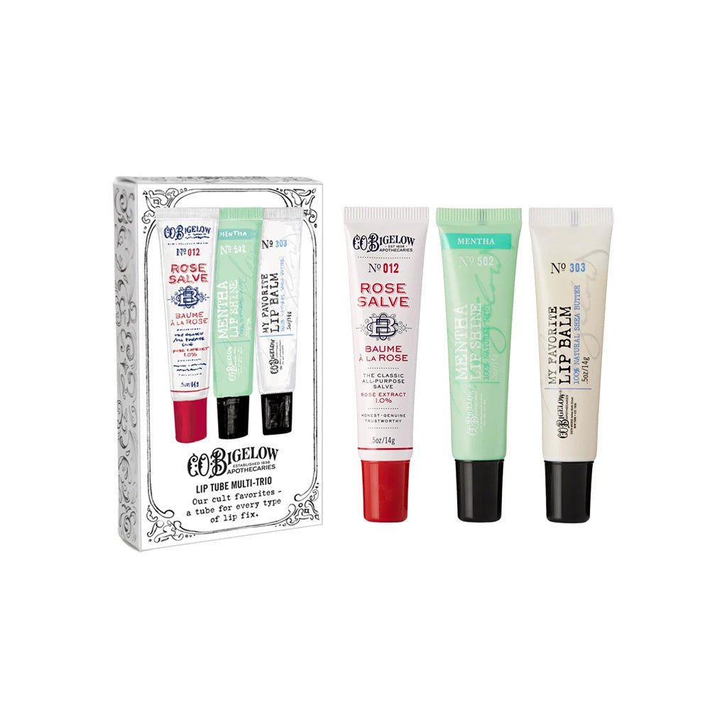 Gift set of three lip balm tubes next to packaging.