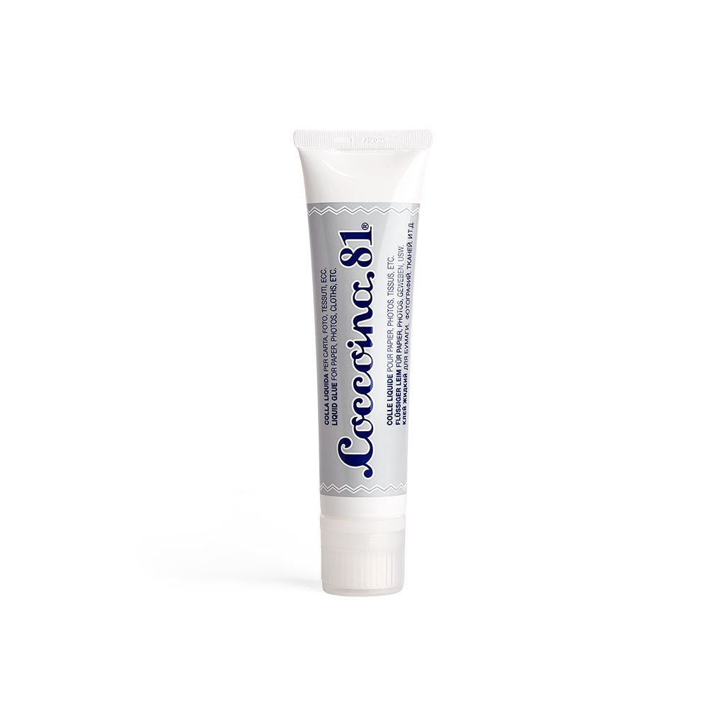 Tube of Coccoina 81 liquid glue on white background