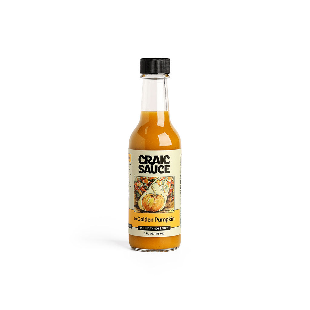 A bottle of Craic Sauce Golden Pumpkin hot sauce.