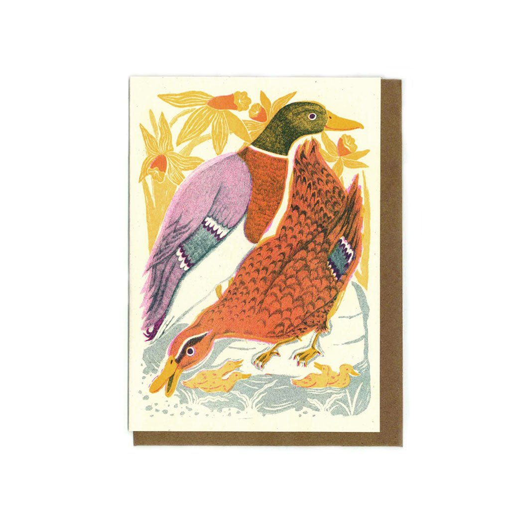 Illustrated greeting card with two mallard ducks with ducklings with a kraft envelope.