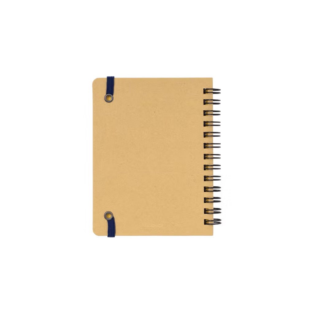 A small notebook with a tan back cover, black spiral binding on the right side, and a dark blue elastic with gold-toned grommets on the left side, shown on a plain white background.