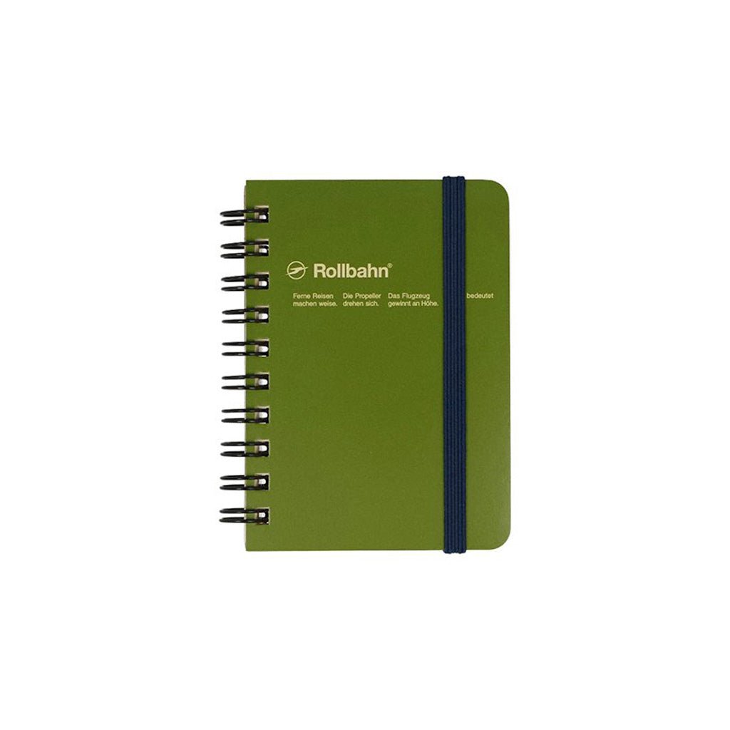 An olive green hardcover spiral notebook with a dark blue elastic closure band and silver wire binding, featuring the Rollbahn logo on the front cover.
