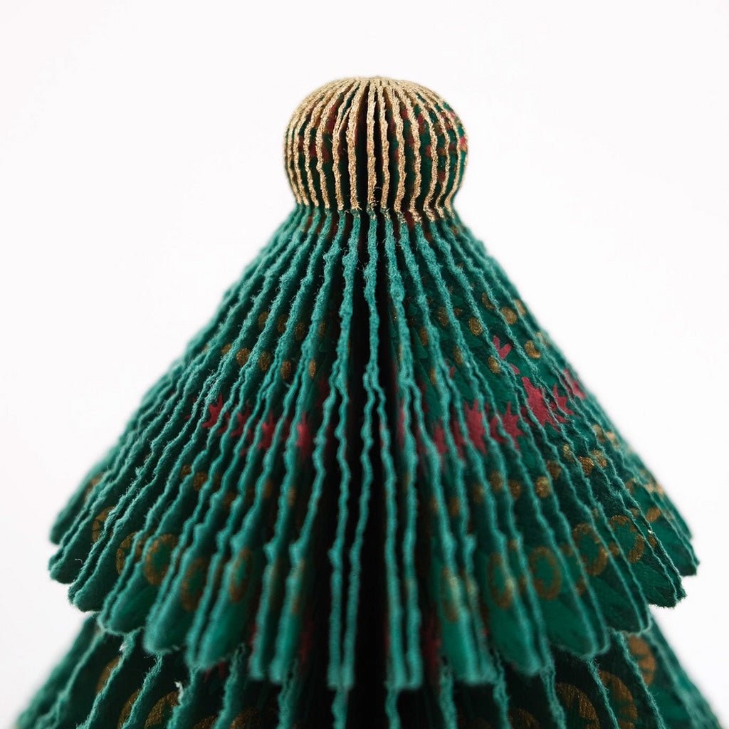 Close-up of top of paper tree decoration.