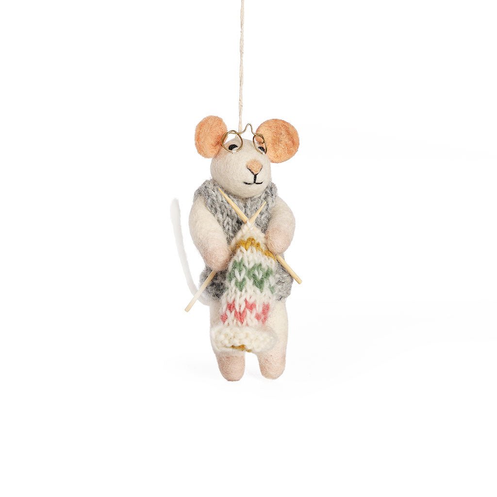 Felted mouse ornament with small knitting accessories.