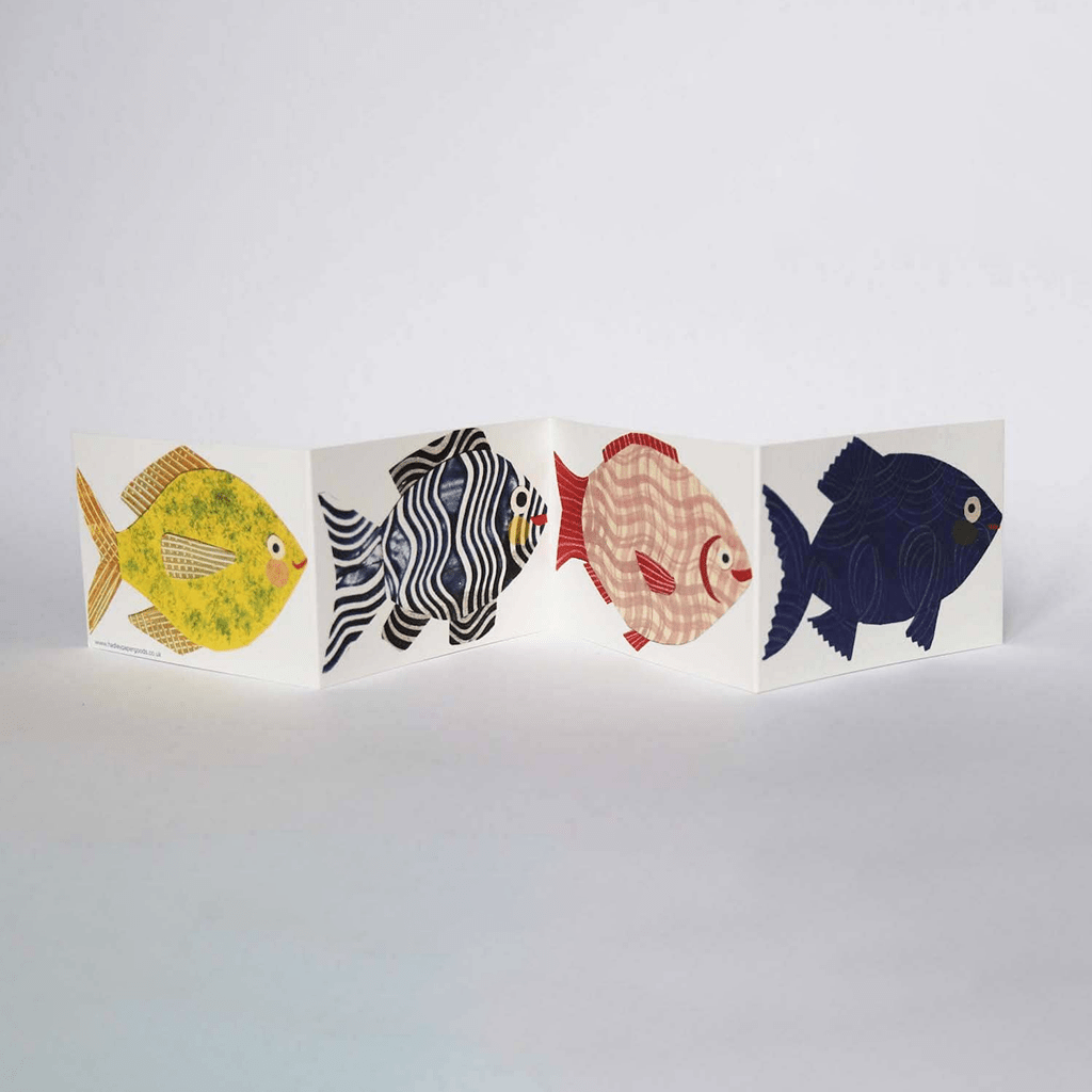 Unfolded fish concertina card on white background
