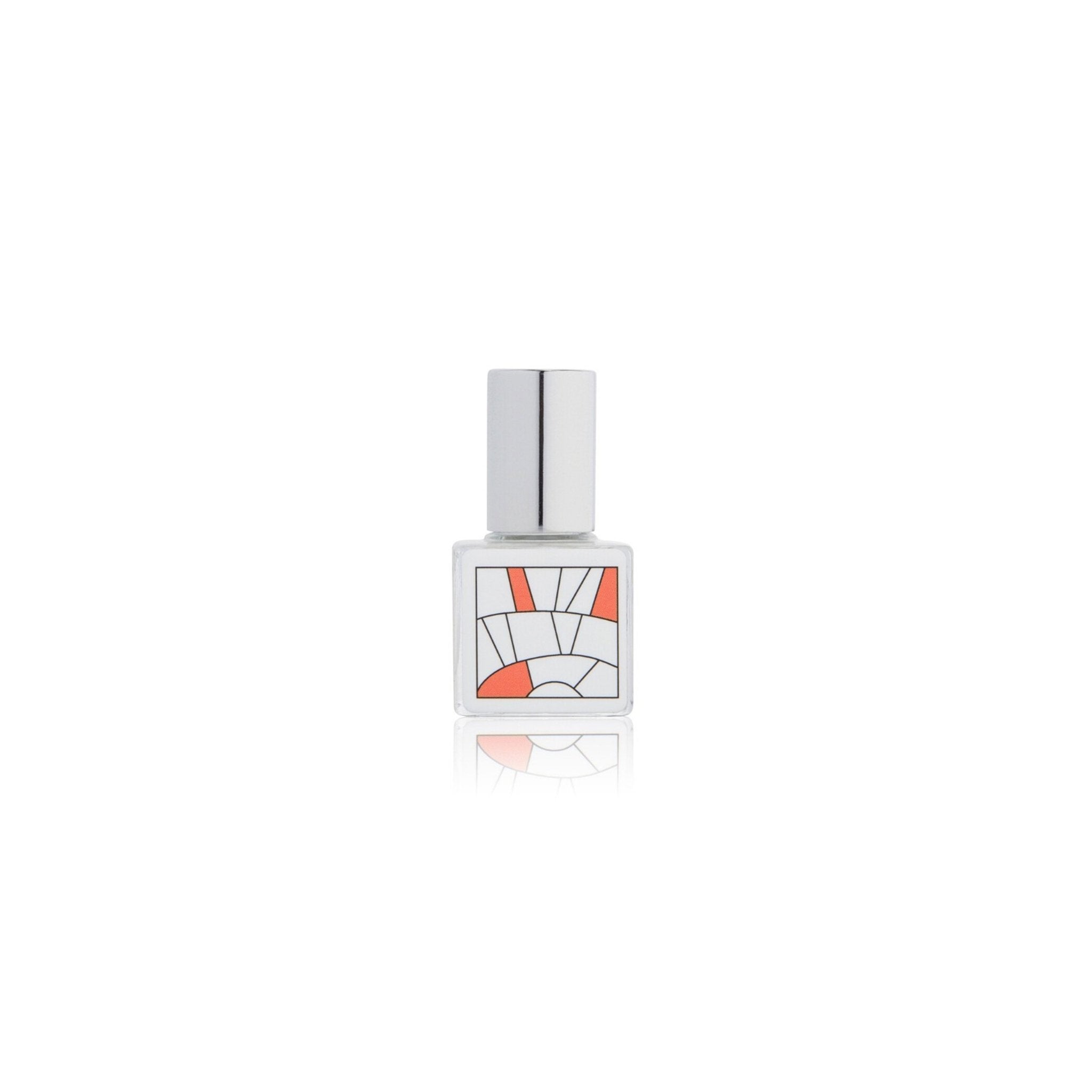 Perfume bottle with geometric design on a white background