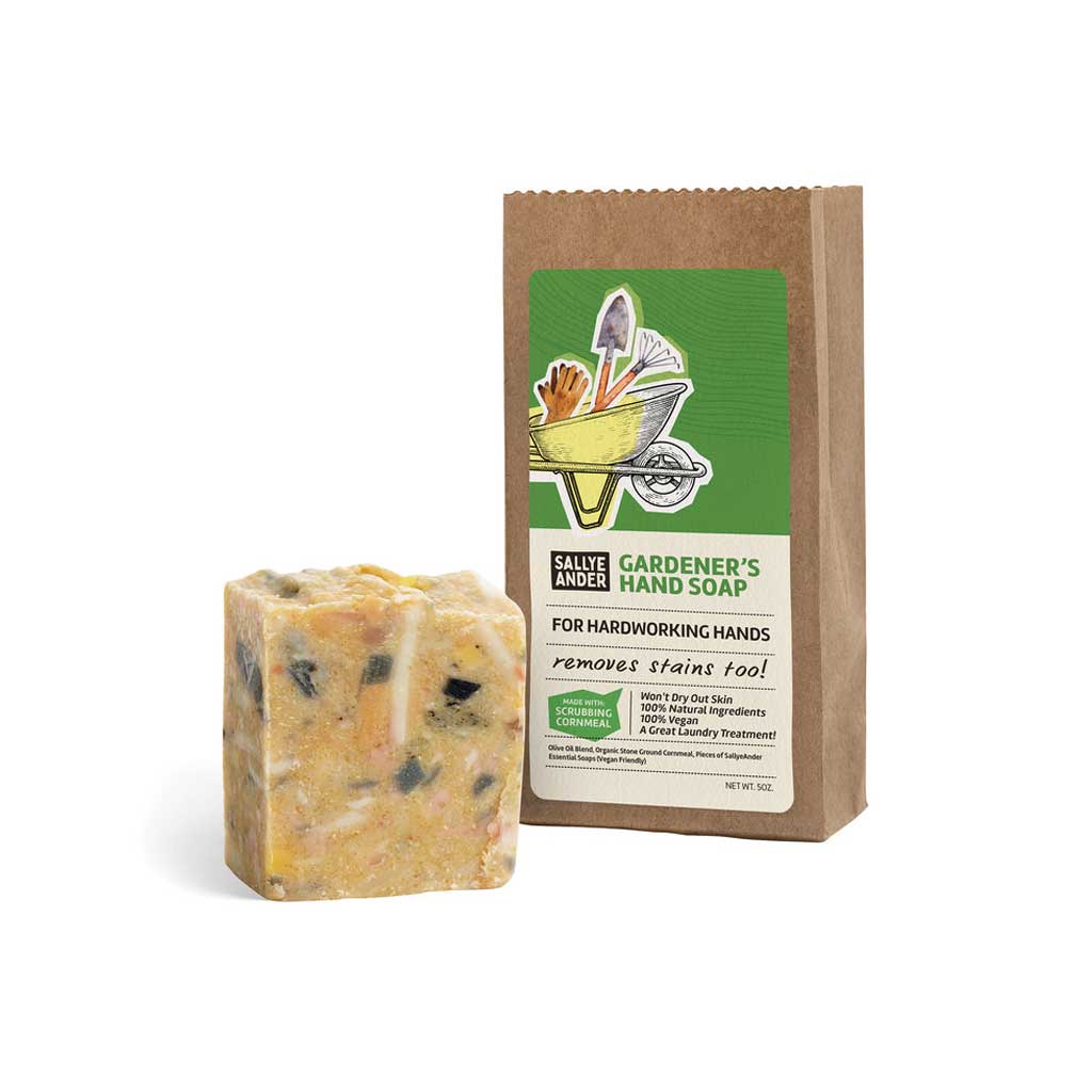 Bar of SallyeAnder stain removing Gardener's Hand Soap on white background next to packaging
