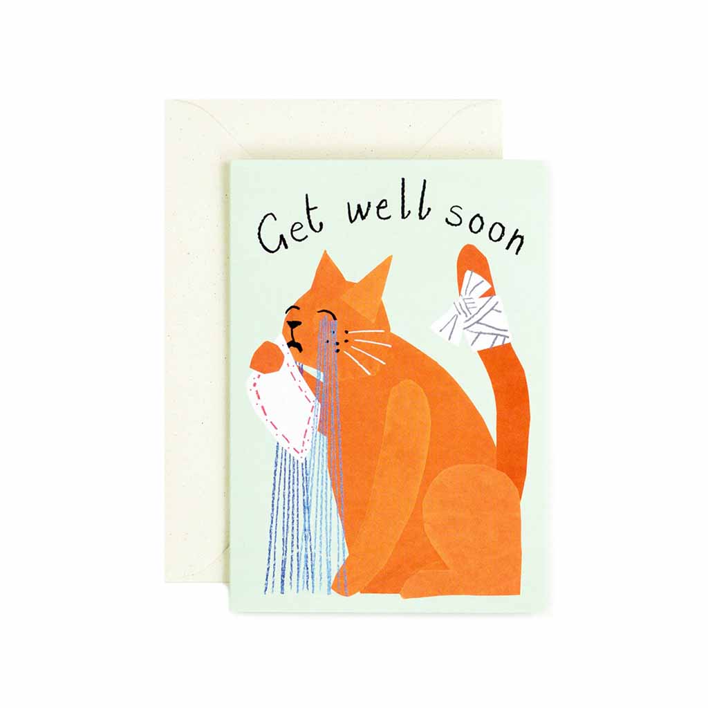Greeting card featuring a crying cat with the text “Get Well Soon,” paired with a cream envelope