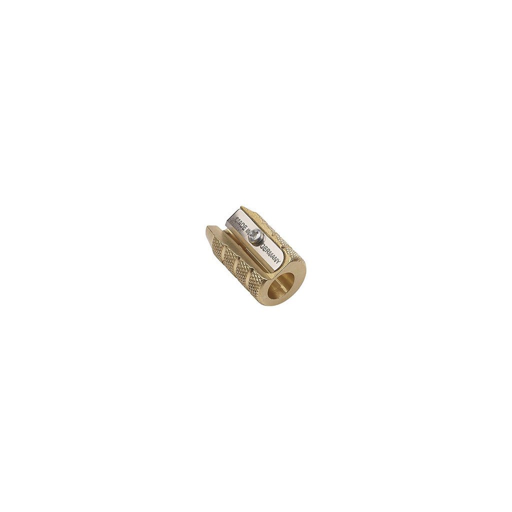 Brass pencil sharpener on white background