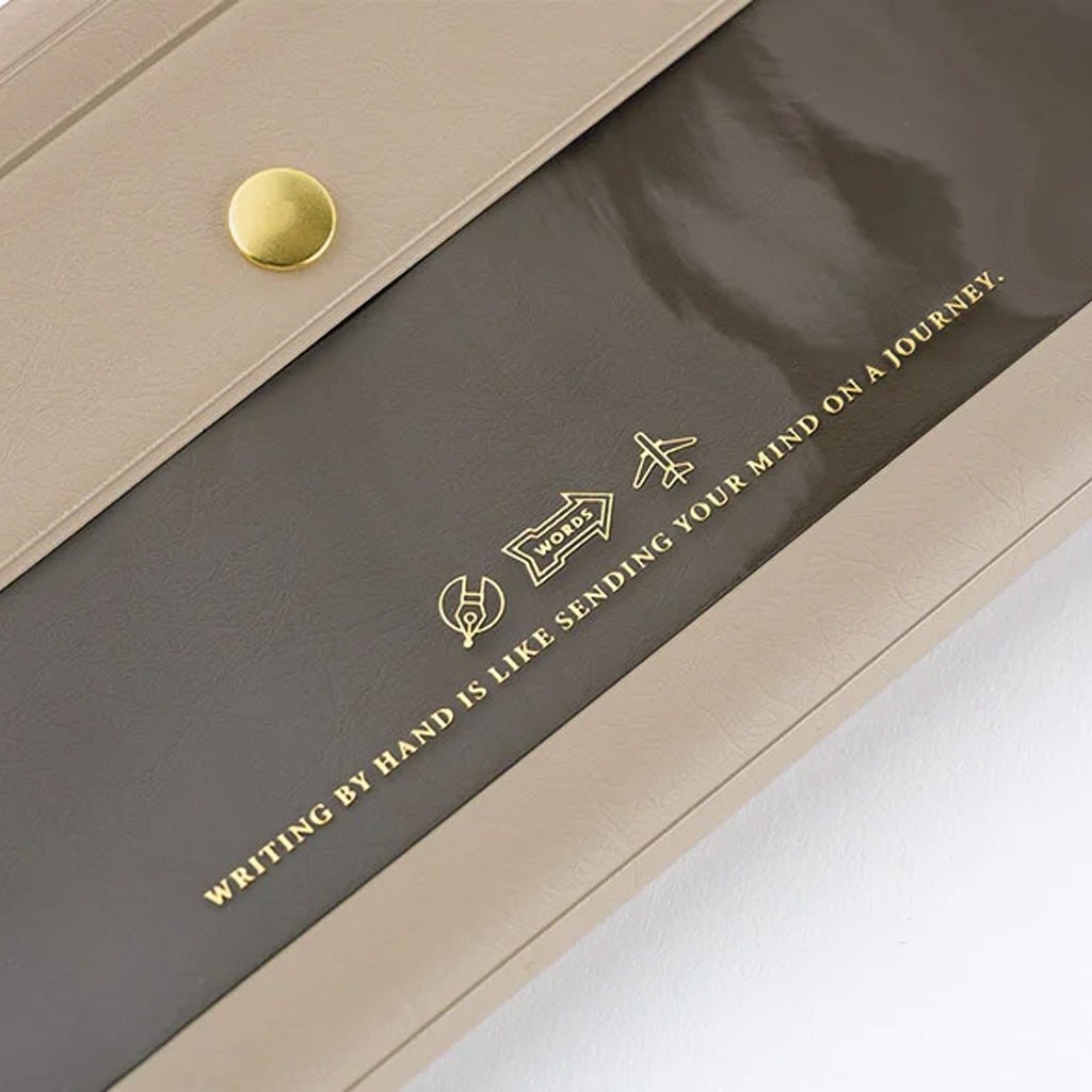 Light warm gray alettone case with front pocket and button closure for Hobonichi Techo Weeks on white background