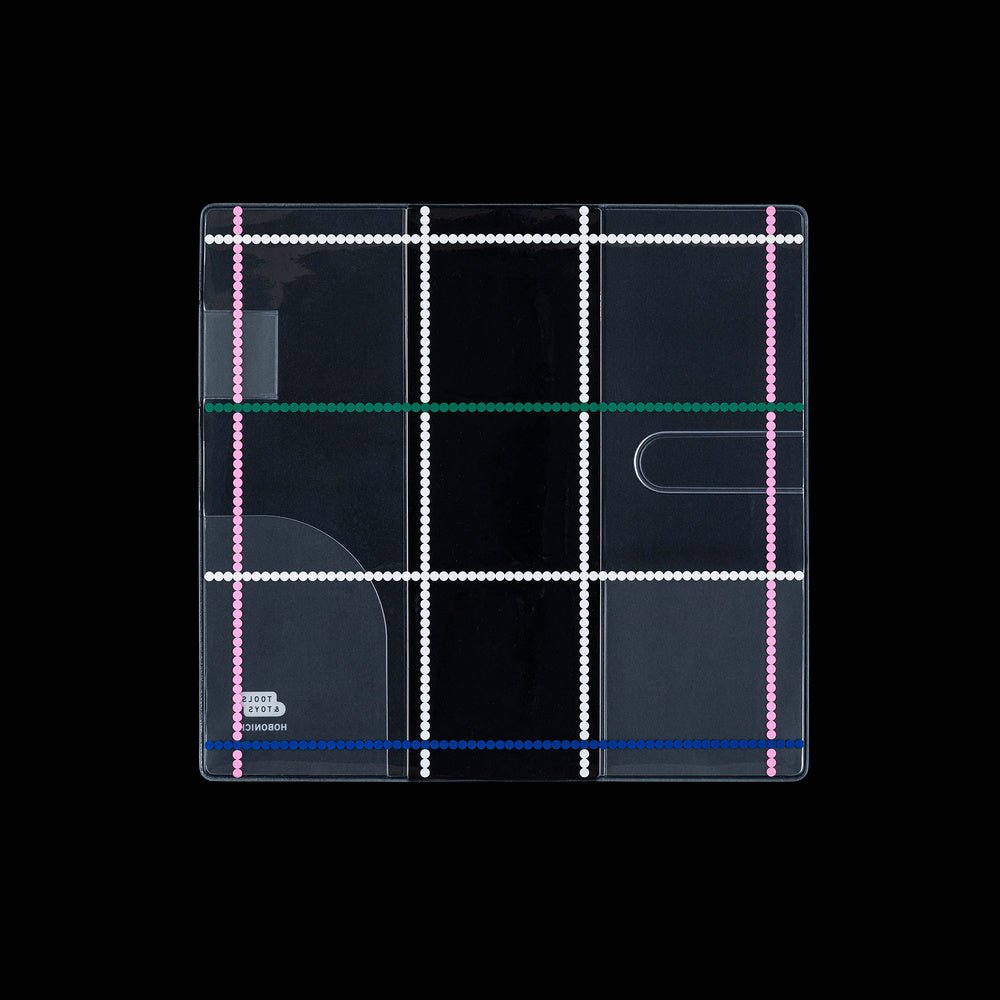 Clear Hobonichi Weeks clear cover with colorful dotted plaid pattern against black background