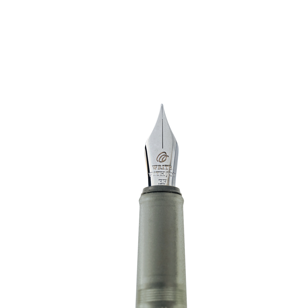 Close-up of a fountain pen nib with the text 'Write with Joy' and gray barrel against a plain white background.