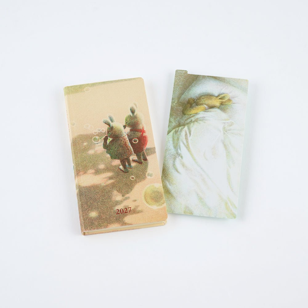 Akiko Miyakoshi pencil board next to 2027 Techo Weeks planner with rabbit illustrations.