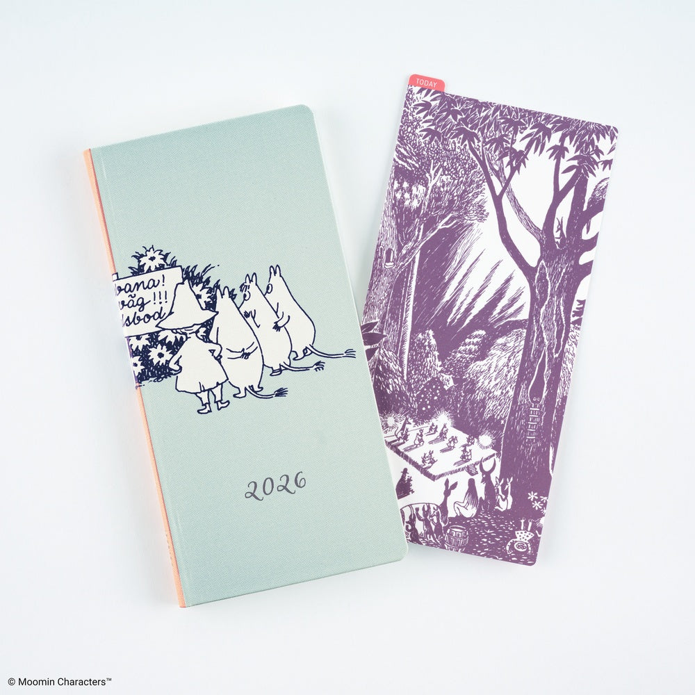 A mint green 2026 Moomin Techo Weeks notebook with black line art illustrations of characters, shown next to a matching purple pencil board featuring a forest scene, on a clean white background.