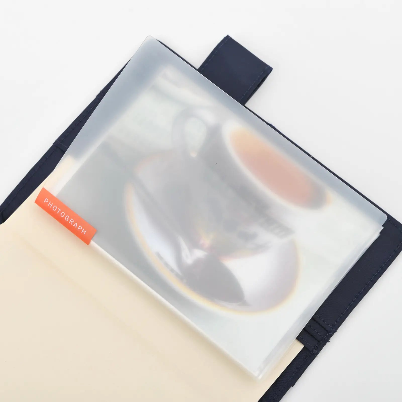 Clear photo album in A6 Hobonichi planner cover against white background