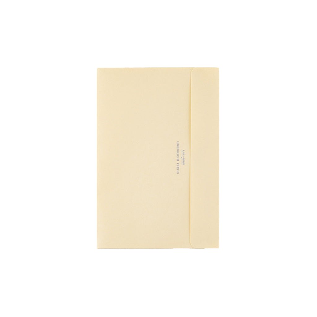A6-sized cream pocket envelope for Hobonichi Techo on white background