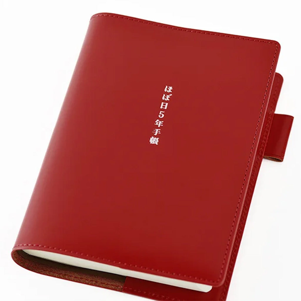 Red A6 leather cover for 5-year journal on white background