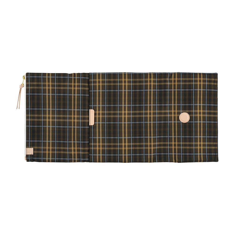 An open Hobonichi Techo cover featuring a plaid pattern with beige and light blue lines on dark brown fabric with a light tan leather details.